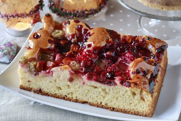 A cake with red summer fruits. Party dessert