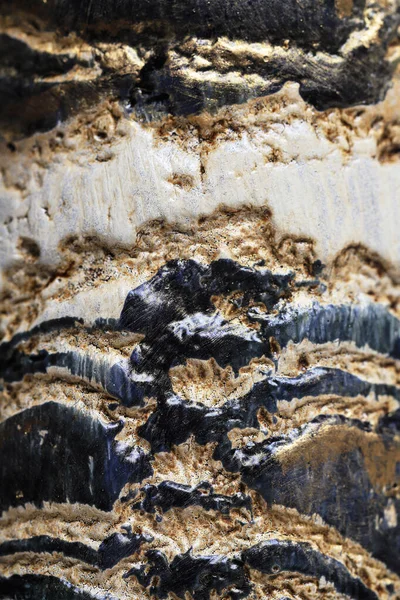 Işığın yansıdığı parlak siyah ve altın bir yüzey. Grafiksel kaynaklar