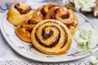 Kanelbulle - swedish cinnamon rolls on the table. Festive dessert