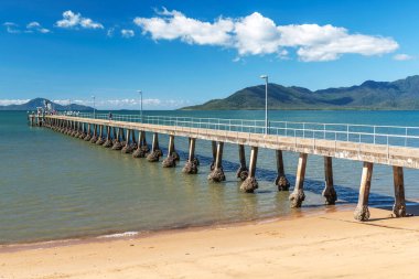 Pier and golden beach in Cardwell town in Queensland, Australia. Cardwellis coastal town and rural localityin Cassowary Coast Region. clipart