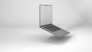 Rotating laptop computer, isolated on background