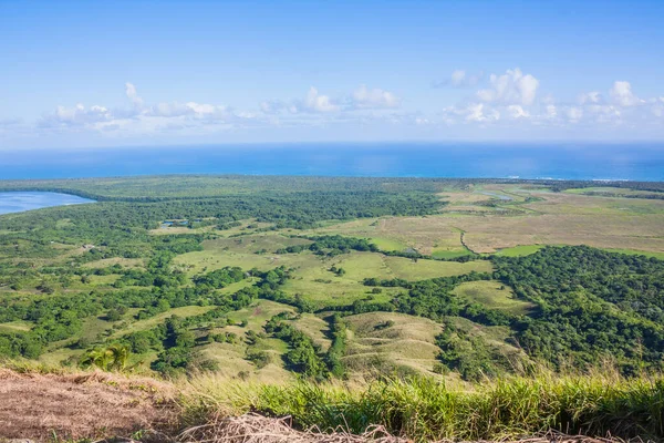 View of the coastline of the Atlantic Ocean on the island of Haiti. Green coastline turns into ocean