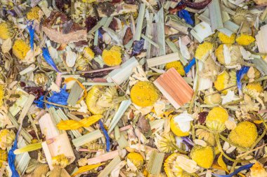 Alpine Field. Herbal tea with lemongrass, flowers and camomile. Top view. Close up. High resolution. Alpine herbs tea as background