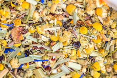Alpine Field. Herbal tea with lemongrass, flowers and camomile. Top view. Close up. High resolution. Alpine herbs tea as background