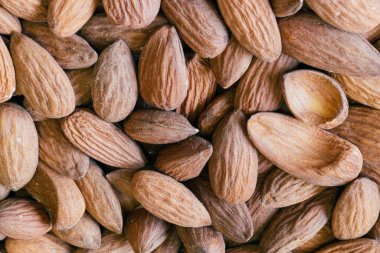 Almond nuts close. Background of almond nuts. Pile of almonds close-up as background.