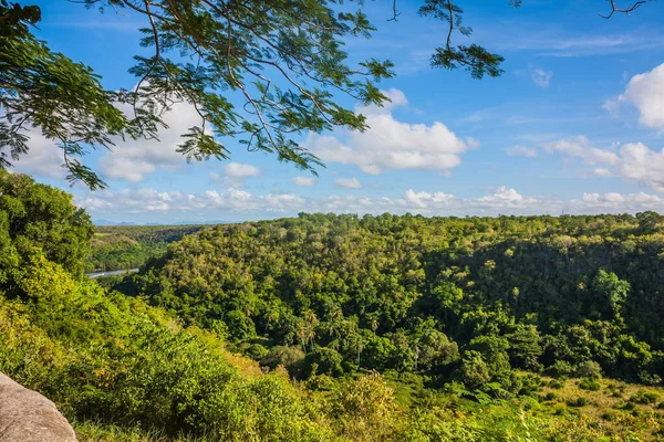 Green mountains and valleys of the island of Haiti. Blue mountains, green valley. Panoramic view of Haiti mountains in summer day. Tourism and travel concept. Natural green forest background panorama.