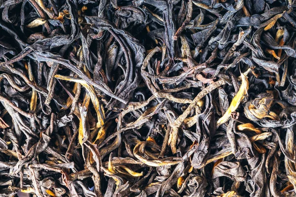 Black tea background. Black tea shot close up. Black tea macro.Top view. Close up. High resolution.