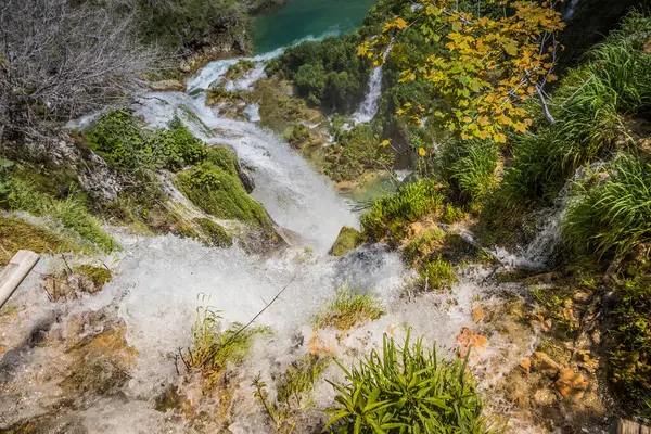 Top view of the beautiful picturesque waterfalls on Plitvice Lakes. Rocks and green trees around lakes with blue water. Breathtaking view in the Plitvice Lakes National Park .Croatia