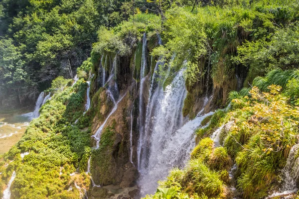Top view of the beautiful picturesque waterfalls on Plitvice Lakes. Rocks and green trees around lakes with blue water. Breathtaking view in the Plitvice Lakes National Park .Croatia
