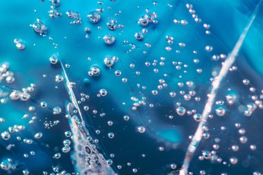 Ice surface with frozen air bubbles, close-up natural texture, ice pattern winter background