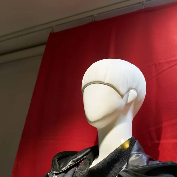 Stock image Head of a female mannequin against red background in a shop window in Colmar in France                                