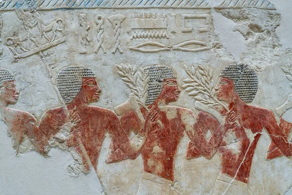 Egyptian soldiers on an ancient Egyptian relief made of painted limestone. New Kingdom 18th Dynasty from the temple of Queen Hatshepsut.