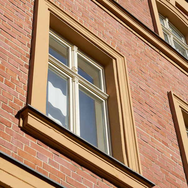 Facade of a house with window and brick facade in the city center of Wittenberg in Germany                               