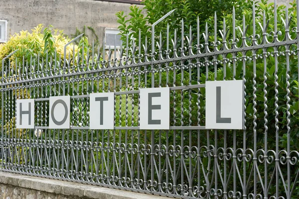 Lettering hotel on the fence of a hotel complex in the popular resort of Malcesine on Lake Garda in Italy