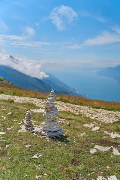 Piles of stones piled up by hikers on the summit of Monte Baldo on Lake Garda near Malcesine in Italy