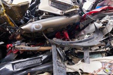 Cars in a scrap yard of a car recycling company in an industrial area in Magdeburg in Germany                                clipart