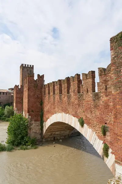 stock image the medieval bridge Ponte Scaligero or Ponte Castelvecchio over the river Adige in Verona, Italy                               