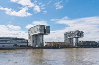   modern residential buildings, crane houses, Kranhaus in the Rheinauhafen in Cologne, seen from the water                               clipart