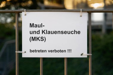   Sign with the German inscription Maul und Klauenseuche, betreten verboten. Translation: Foot and mouth disease, no trespassing                              clipart