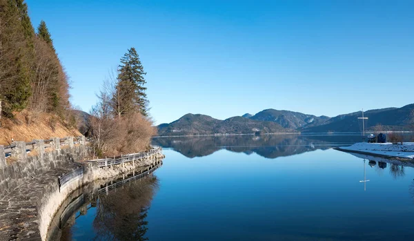 stock image calm scenery at lake Walchensee, upper bavaria with reflecting mountains in the water