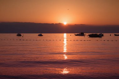 sunrise Kvarner Bucht, Moscenicka Draga. romantic scnenery with moored motorboats and mountains