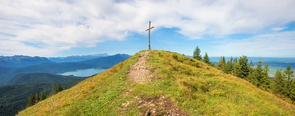 stock image summit Hirschhornlkopf, with mountain cross and view to lake Walchensee, hiking destination bavarian alps