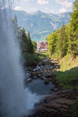 giessbach waterfall with view to hotel and lake Brienzersee, Bernese Alps landscape clipart