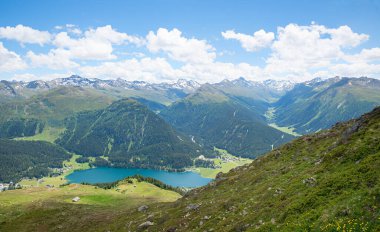 view from Parsenn hiking trail to lake Davoser See and Rhaetian alps, switzerland clipart
