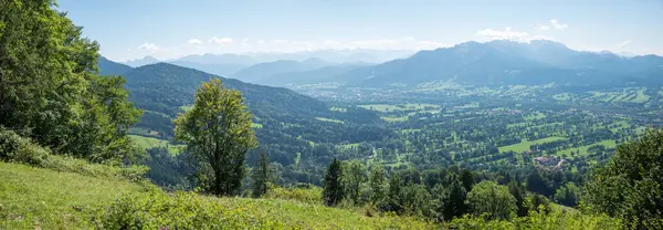 stock image Cultural landscape near Lenggries with parallel tree hedges. View from Sunntraten mountain. upper bavaria in summer. brauneck mountain.