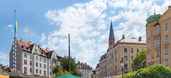 stock image beautiful Wiener Platz, district Haidhausen, historical munich, blue sky with clouds. detail shot from the upper half