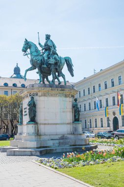 Equestrian monument for King Ludwig I at Odeonsplatz in Munich. flowerbeds around.  clipart