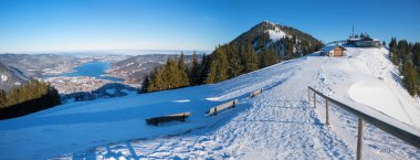 way to mountain station of the gondola lift on the wallberg, view to the summit and tegernsee. tourist destination upper bavaria in winter. clipart