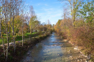 Jenbach river and footpath beside, autumnal landscape Bad Feilnbach, upper bavaria clipart