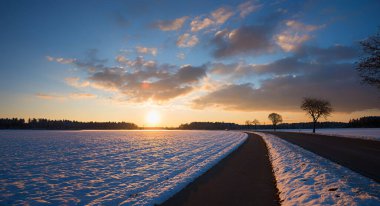 country road and bike way to Brunnthal village, sunset scenery in winter, landscape upper bavaria clipart