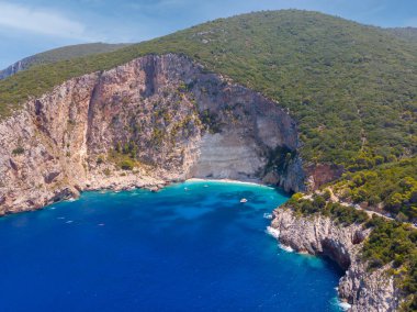 Drone shot of Zakynthos island with beautiful turquoise Ionian sea and limestone cliffs near famous Navagio beach during daytime in Greece, Europe