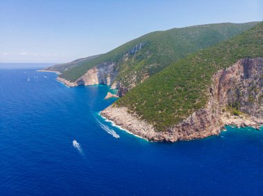 Drone shot of Zakynthos island with beautiful turquoise Ionian sea and limestone cliffs near famous Navagio beach during daytime in Greece