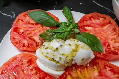 Caprice salad with fresh tomatoes and cheese