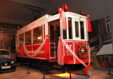 Turkey, Antalya, January 26, 2023. An old rare red tram decorated with ribbons and flowers