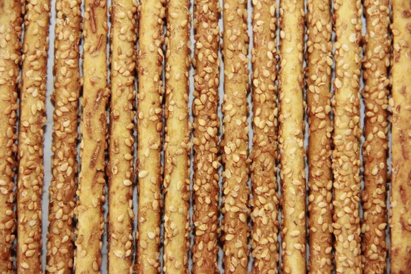 Dry baked long sesame sticks with seeds