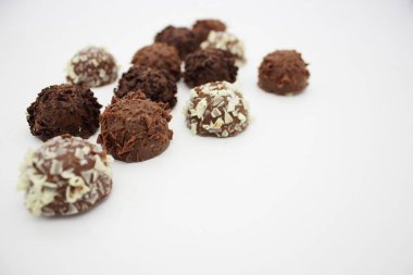 Few chocolates on white background Futtography up close
