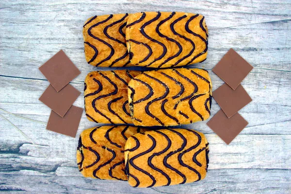Wonderful Biscuit Cakes Poured Chocolate Stand Wooden Background — 스톡 사진