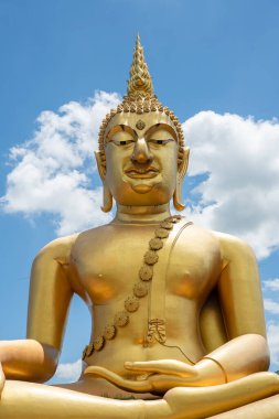 Golden Buddha Statue On Blue Sky. Big Golden Buddha Statue At Saraburi Temple.