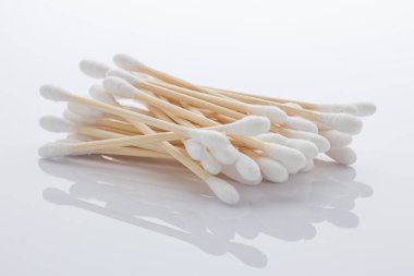 Pile of cotton swabs made of bamboo on bright white background. Zero waste concept.
