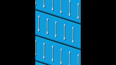 Moving pattern of cotton swabs on an electric blue background. The swabs seem to move in a production line. Zero plastics concept.