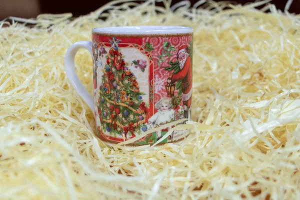 Mug with christmas decoration in straw