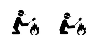 Adam kamp ateşinin yanında oturur, ellerini ve şekerlemelerini ısıtır. Şekerlemeler, ateş alevi. Durun, ateş açmayın. Sopacı, çöp adam figürleri ikonu ya da resimli resim. Turizm, yaz kampı, kamp için şömine..