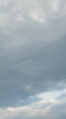 Cloudscape. Time lapse of white clouds. Fast moving fluffy clouds in blue sky. Cloudscape movement. Amazing stormy sky. Beautiful nature landscape. Vertical video