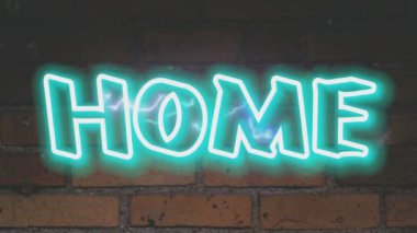 Tuğla duvar arkaplanındaki ev neon kelimesi