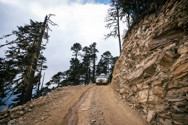 stock image Driving car on high altitude mountain trail, China