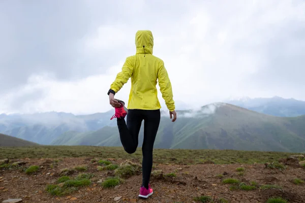 stock image Woman trail runner cross country running at high altitude mountain peak